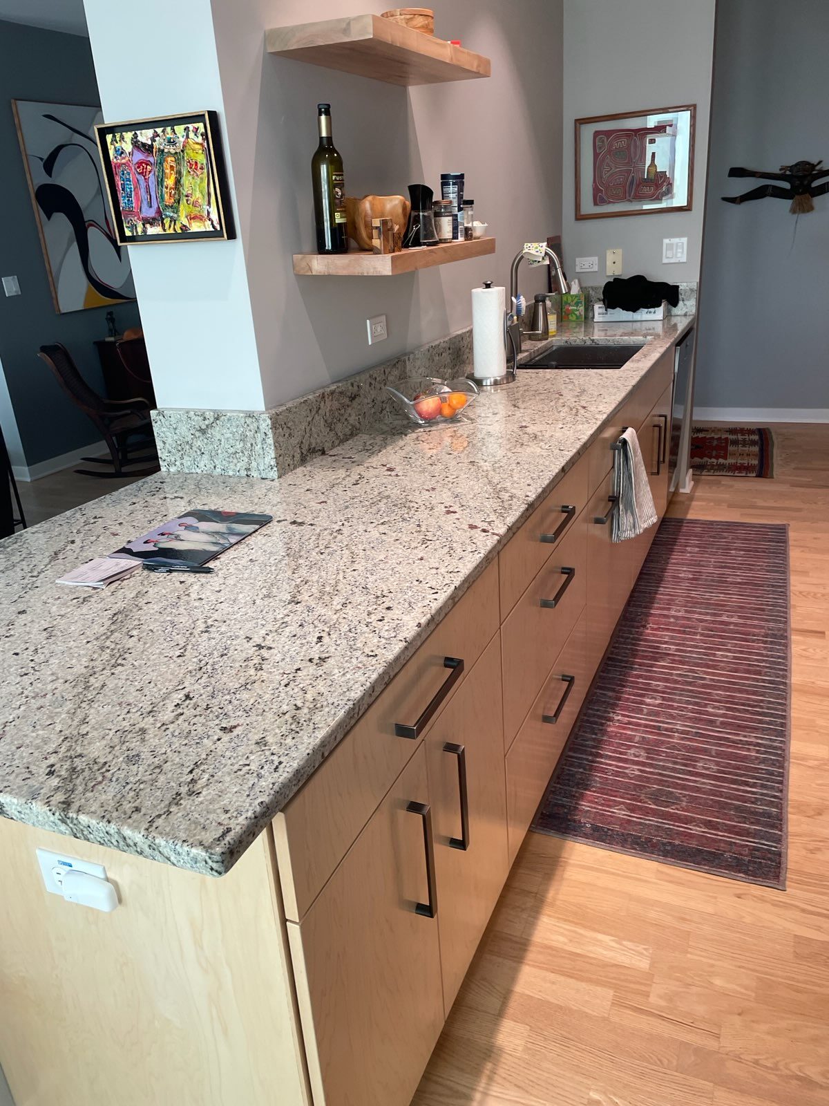 A kitchen with a counter and a sink